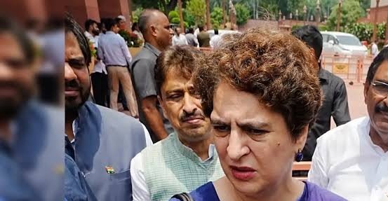 A political controversy erupted after BJP MPs felicitated Dharmendra Pradhan in Parliament following his resignation. Priyanka Gandhi questioned the move, calling it insensitive amid the NEET paper leak protests.

